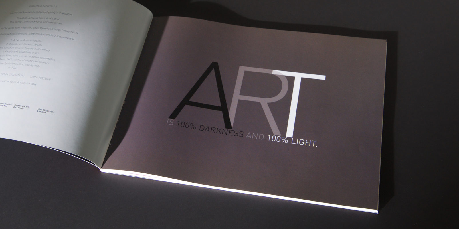 ThisAbility_darknesslight is typographic art of the line "Art is 100% darkness and 100% light."